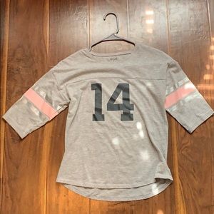 Gray with striped tee that says 14